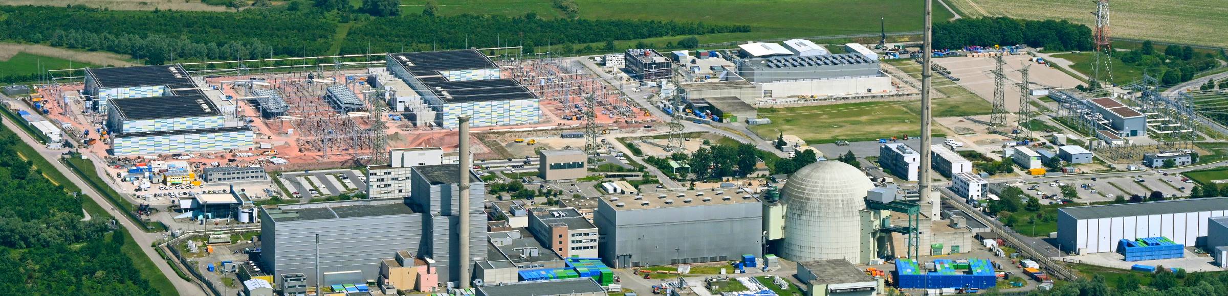 Remains of the decommissioned reactor blocks and facilities of the nuclear power plant - KKW Kernkraftwerk EnBW Kernkraft GmbH, Philippsburg nuclear power plant and rubble of the two cooling towers at the shore of the Rhine river in Philippsburg in the state Baden-Wuerttemberg, Germany